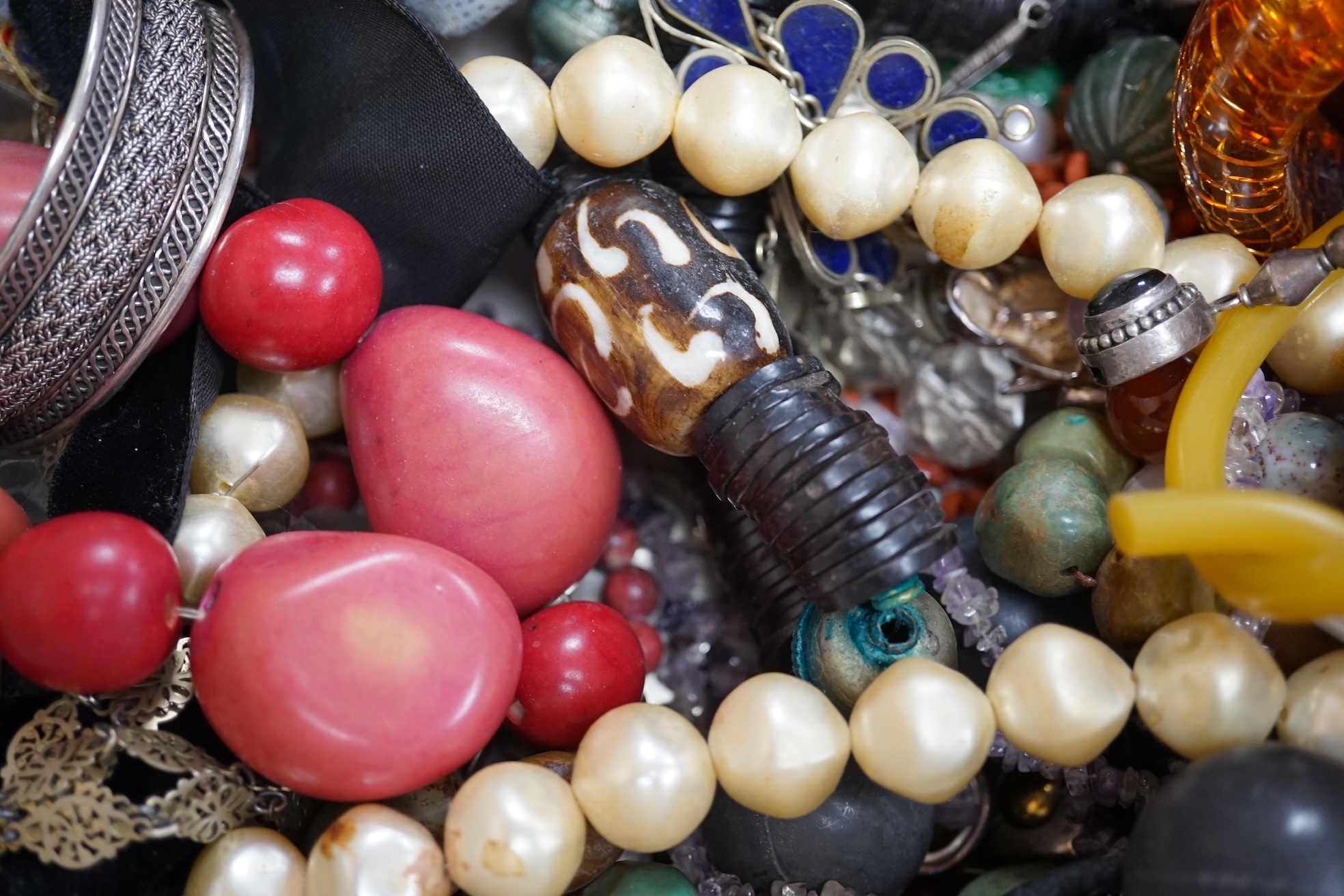 A quantity of assorted early 20th century and later jewellery, including costume, 925 earrings, white metal bangles, rock crystal bracelet, carved jade earrings, lapis lazuli earrings, amethyst earrings, coral branch nec